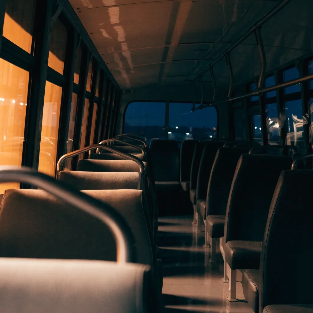 Empty airport shuttle interior at night